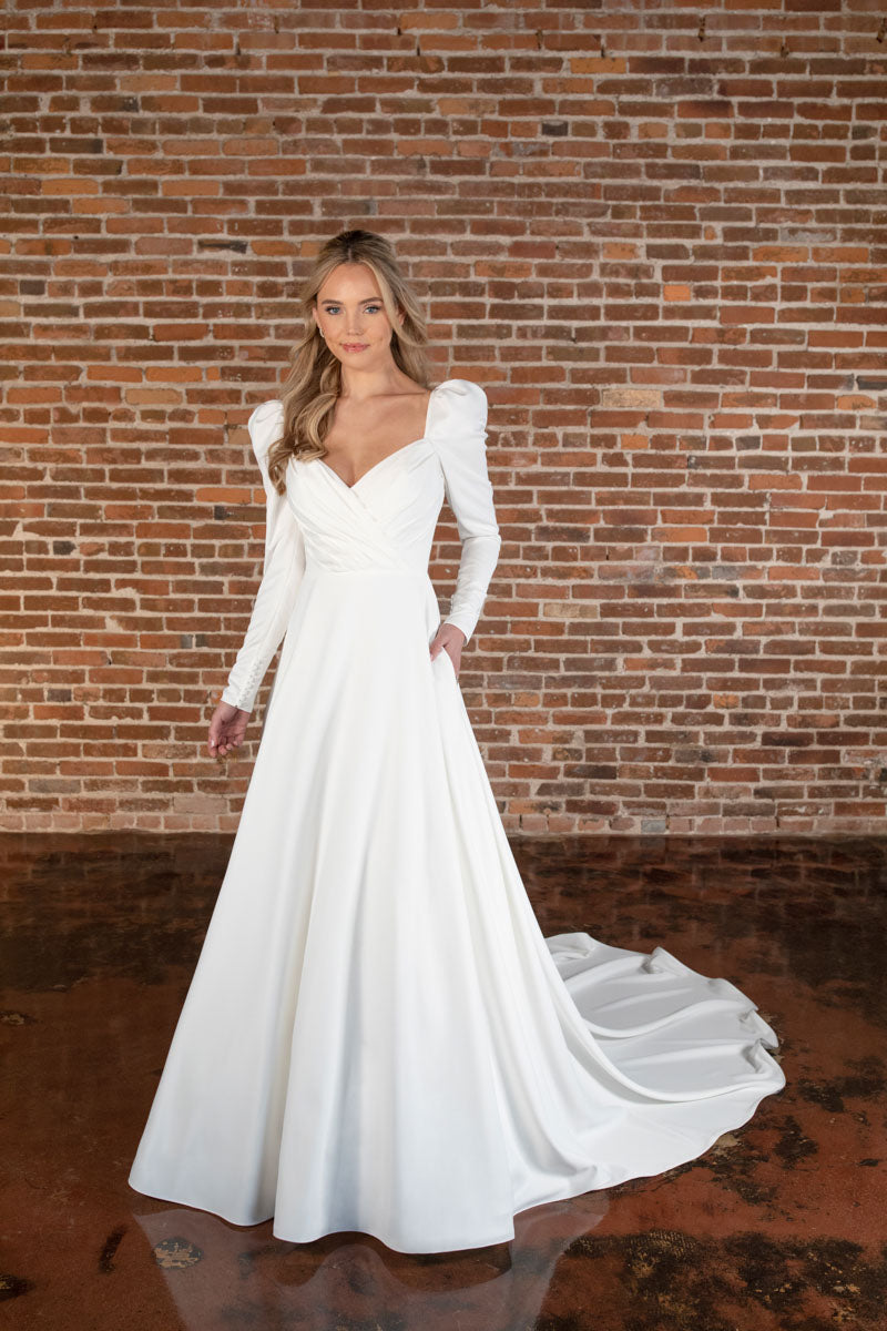 simple, long sleeve wedding gown available in plus sizes