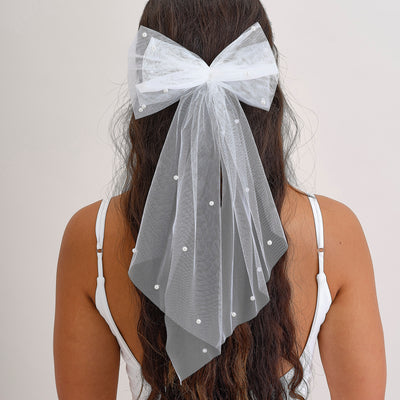 White hair bow with pearls