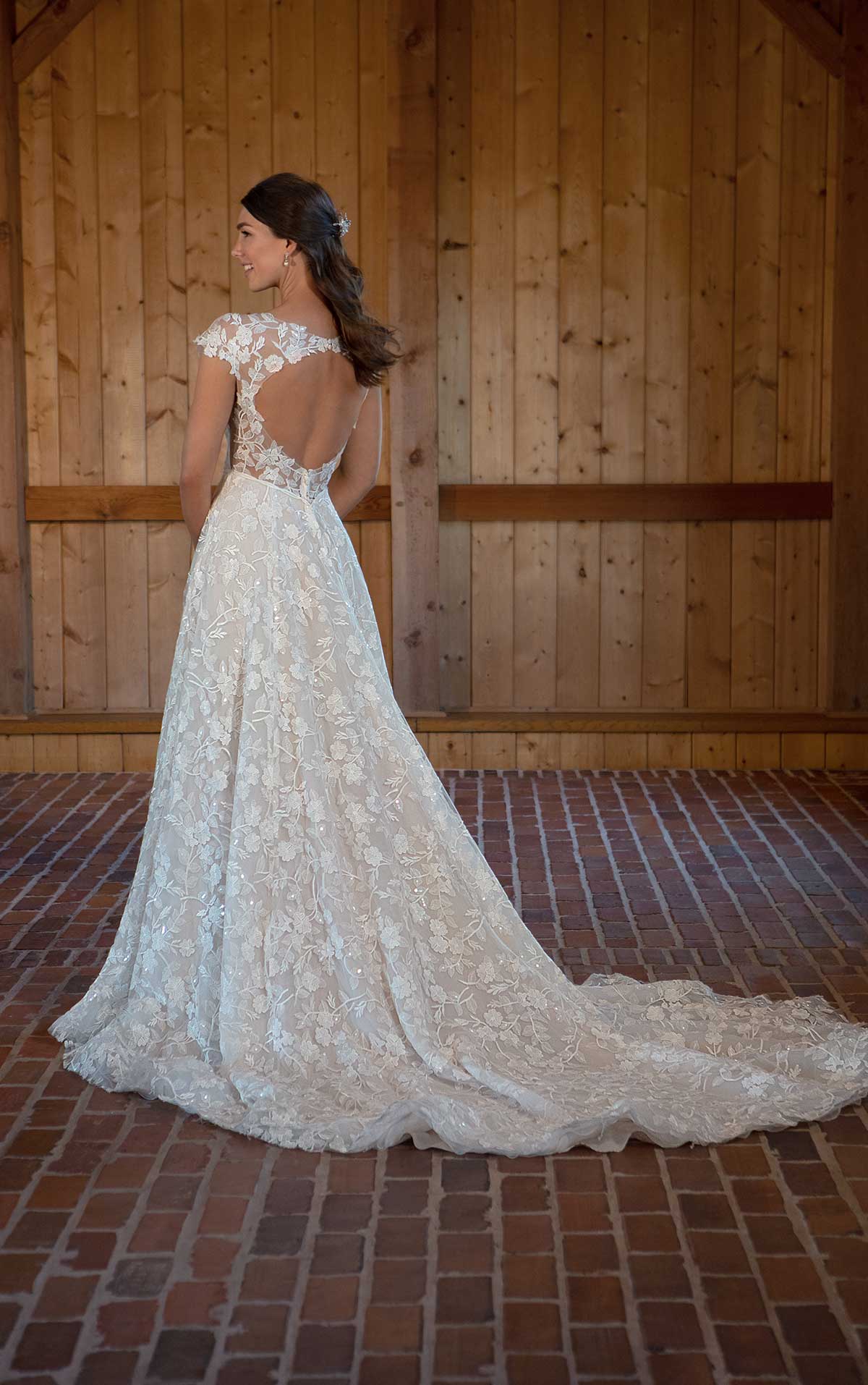 Romantic bridal gown with Peekaboo open back, plunge neckline and floral details