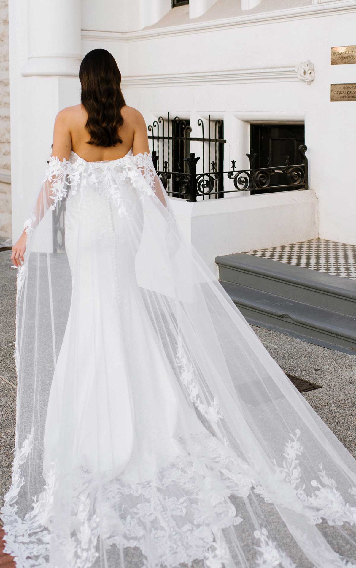 Off the shoulder fit and flare wedding dress with crepe skirt and detachable train 