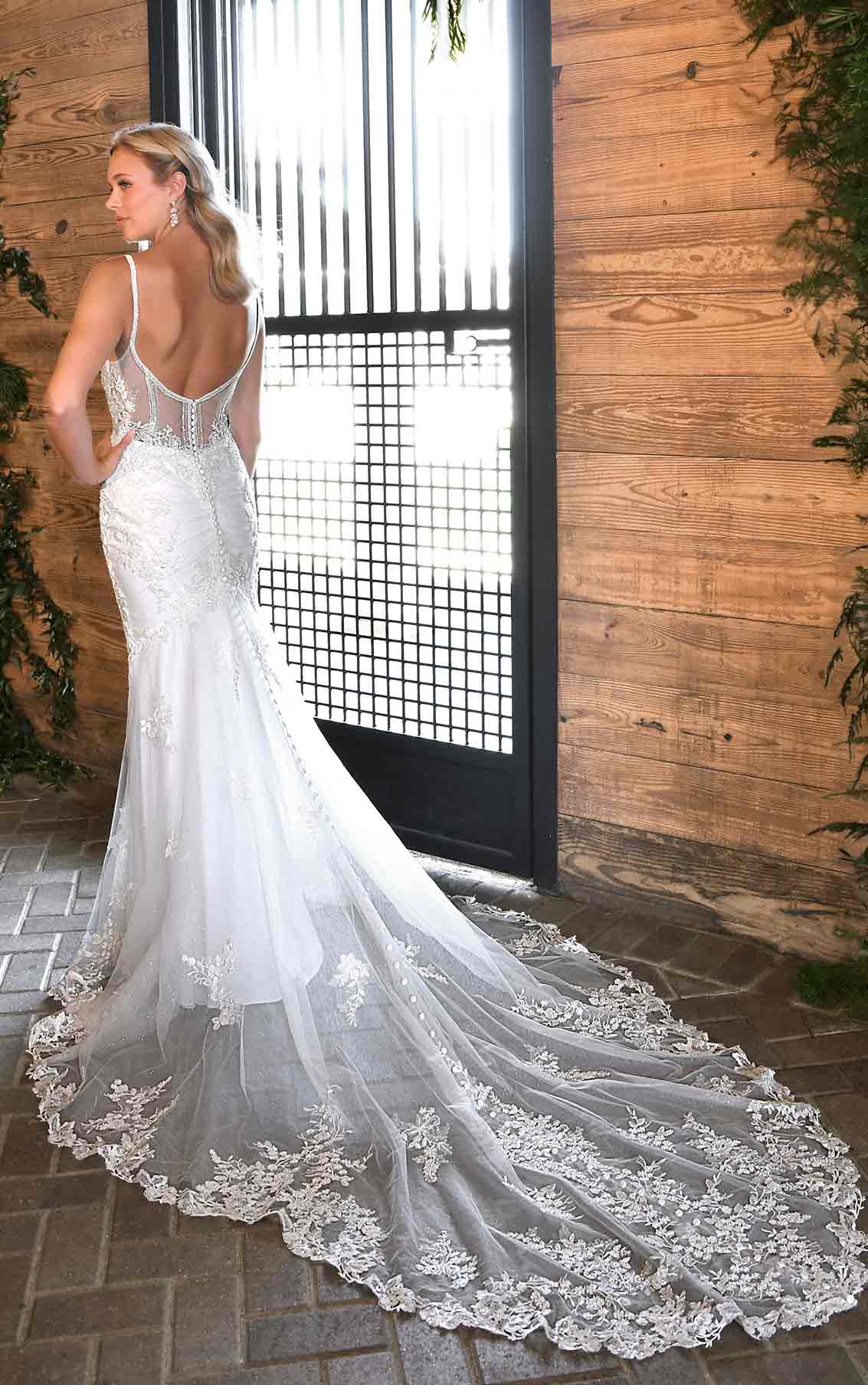 Fit and flare wedding dress with sheer bodice and lace train 